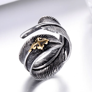Vintage stainless steel feather ring with adjustable open design and gold cross emblem