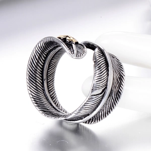 Vintage oxidized stainless steel feather ring with golden eagle crest detail