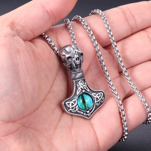 Vintage Thor's Hammer pendant with skull motif and green gemstone on box chain
