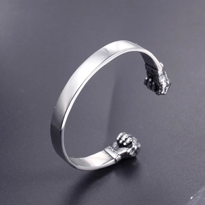 Bracelet jonc vintage en acier inoxydable avec motif double poing de boxe en argent poli