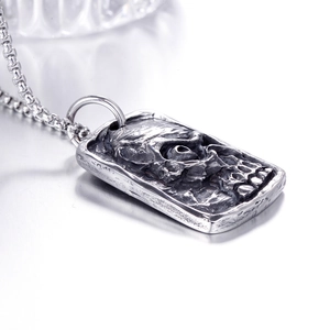 Vintage stainless steel rectangular necklace with embossed skull pendant on link chain