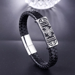 Braided leather bracelet with stainless steel cross plaque and magnetic clasp