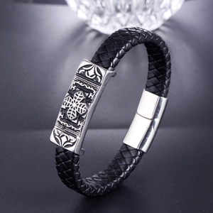 Braided black leather bracelet with steel cross ornament and magnetic clasp for men