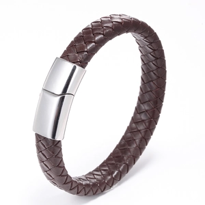 Detail of woven dark brown leather cord with polished silver magnetic clasp closure