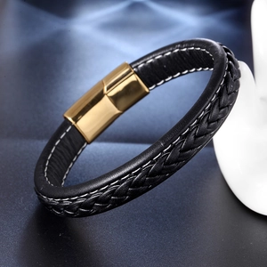 Fashionable braided black leather bracelet featuring a polished gold magnetic clasp