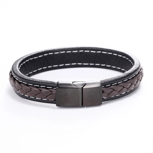 Close-up of double-layer woven leather bracelet with black magnetic clasp in industrial style