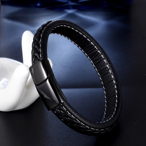 Men's minimalist braided black leather bracelet with magnetic metal clasp on hand model