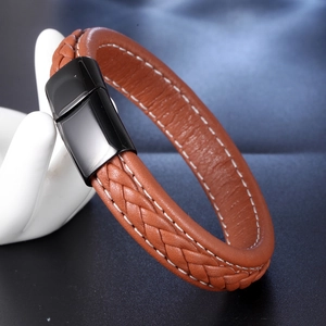 Brown braided leather bracelet with white stitching and black magnetic metal clasp