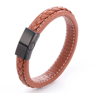 Detail of brown braided leather bracelet with white stitching and matte black magnetic clasp