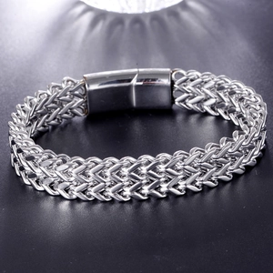 Men's punk stainless steel wheat chain bracelet with polished magnetic clasp on black background