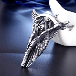 Macro detail of Gothic Grim Reaper pendant with wings in antique stainless steel