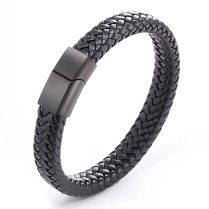 Detailed view of handmade black braided leather bracelet with matte black magnetic clasp