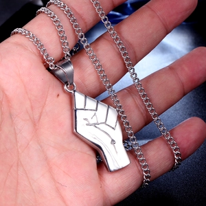 Men's stainless steel necklace featuring a bold silver fist pendant and curb chain style