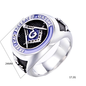 Detail view of Freemason ring with blue enamel inlay and engraved Mason symbols