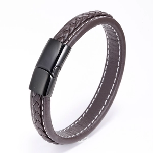 Detail view of brown braided leather bracelet with white stitching and black magnetic clasp