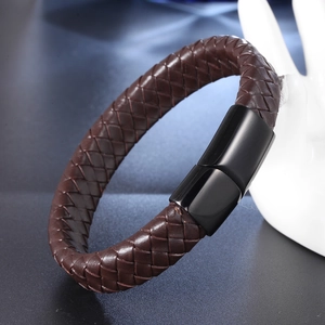 Men's brown braided leather bracelet with black magnetic clasp on display stand