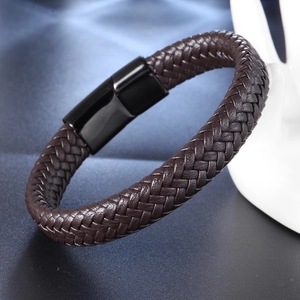 Braided dark brown leather bracelet with black magnetic steel clasp for men on white display