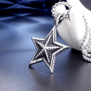 Vintage stainless steel star pendant necklace with oxidized finish on a round box chain