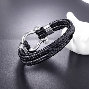 Men's multi-layer black braided leather bracelet with silver horseshoe shackle clasp