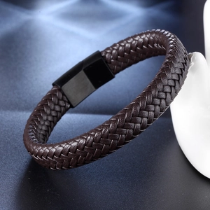 Men's dark brown braided leather bracelet with black magnetic clasp on display