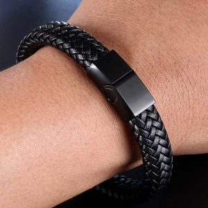Men's black braided leather bracelet with matte magnetic clasp on wrist model