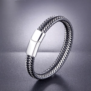 Detail showing woven black leather with stainless steel wire and polished metal clasp