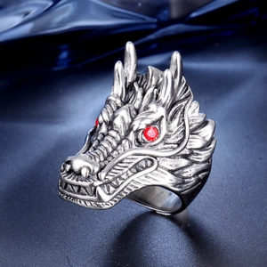 Macro shot of punk dragon ring with vintage finish and red rhinestone eyes detail
