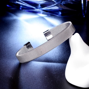 Silver mesh woven stainless steel open cuff bracelet for men on sleek white stand