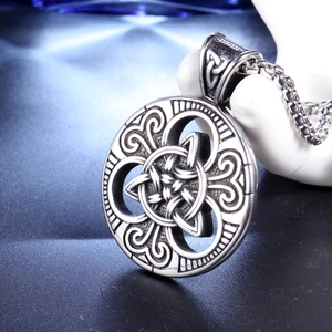 Viking Celtic knot necklace in silver stainless steel on a ceramic hand model