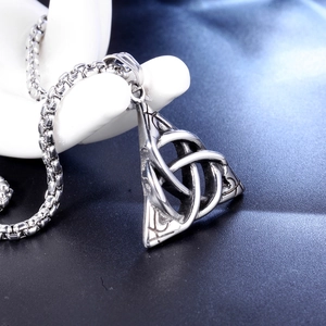 Vintage stainless steel triquetra knot necklace on a display stand in silver finish