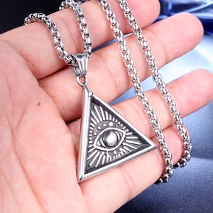 Macro shot of punk Freemason Evil Eye pendant in vintage stainless steel finish
