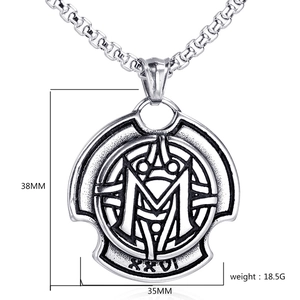 Macro detail of silver Odin symbol M pendant with dimensions 38mm by 35mm and box chain