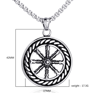 Detailed view of stainless steel compass pendant showing 42mm height and 17.3g weight
