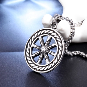 Vintage stainless steel compass pendant for men featuring an antique silver finish and box chain