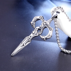 Vintage stainless steel cross dagger pendant necklace with detailed relief patterns