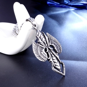 Punk style stainless steel cross wings pendant necklace displayed on a hand stand