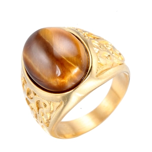 Golden stainless steel ring with oval brown tiger eye stone and vintage filigree details