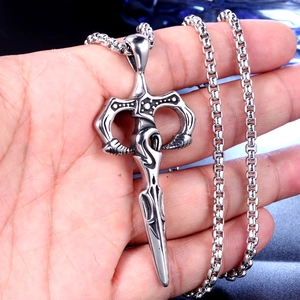 Gothic vintage silver dagger pendant with stainless steel box chain shown held in hand