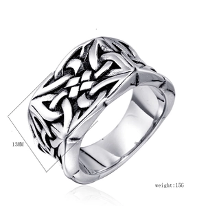 Detail shot of 13mm wide Celtic knot pattern on a vintage punk style steel ring