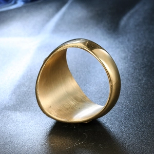 Detailed macro view of gold-plated stainless steel ring with brushed inner surface