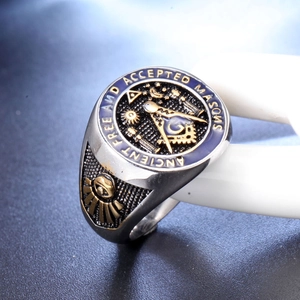 Macro detail of Masonic ring with blue enamel and engraved ancient mason text