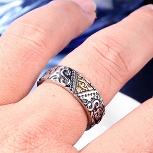 Detail of vintage steel ring featuring Masonic Eye of Providence and embossed textures