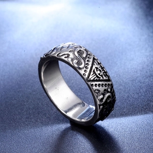 Detailed close-up of retro silver Masonic Eye of Providence ring in vintage steel