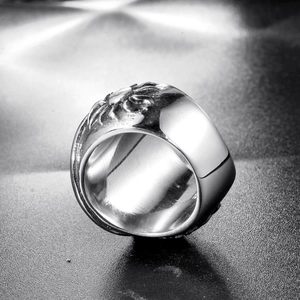 Macro view of vintage punk pirate skull ring with detailed sun totem relief pattern