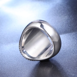 Detailed macro view of wide silver titanium ring with beaded edges and polished interior
