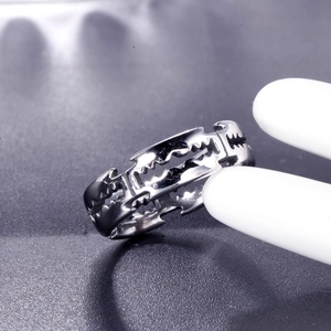 Polished stainless steel razor blade ring in punk style shown on a jewelry display stand