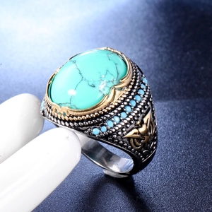 Bague punk vintage pour hommes avec turquoise et détails de plumes dorées gravées