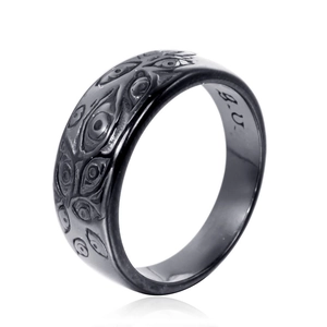 Vintage black stainless steel wide ring with embossed eye patterns and B.U. engraving