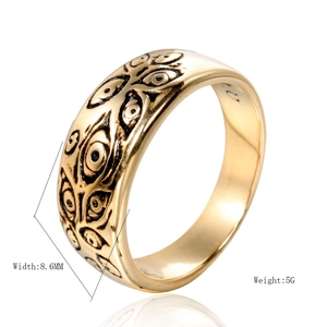 Vintage gold-plated titanium steel ring with embossed eye patterns on 8.6mm wide band