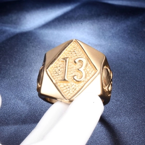 Punk style hexagon gold stainless steel ring featuring embossed number 13 on silk